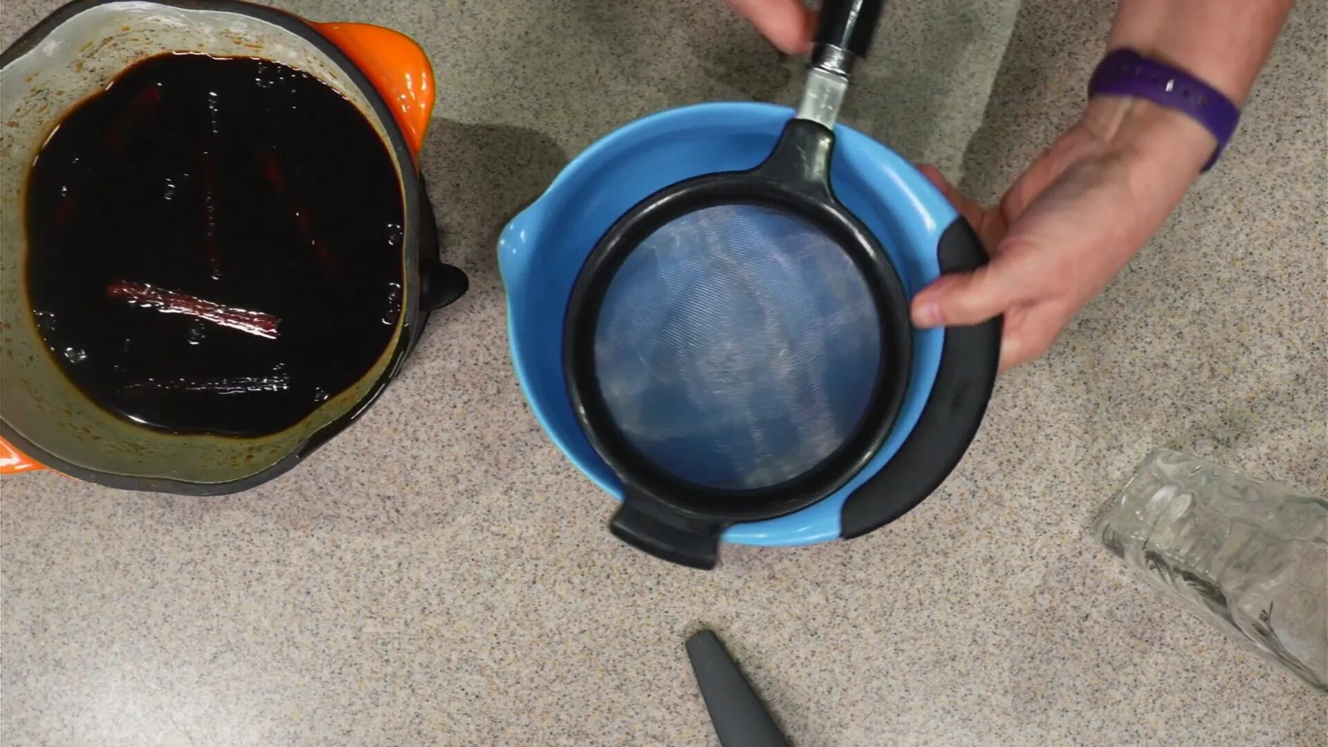 Straining the syrup to remove spices.
