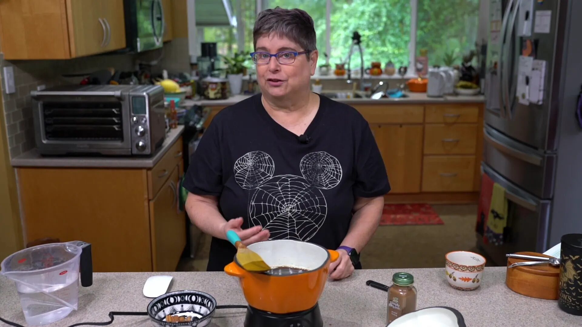 Adding cinnamon sticks to the mixture.