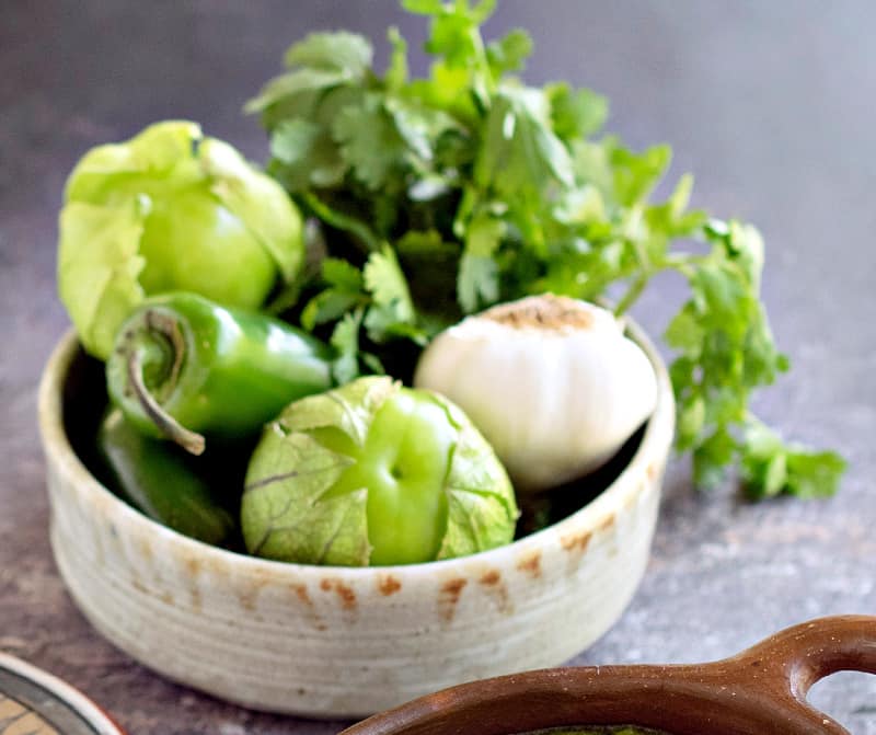 tomatillos, onion, garlic in bowl
