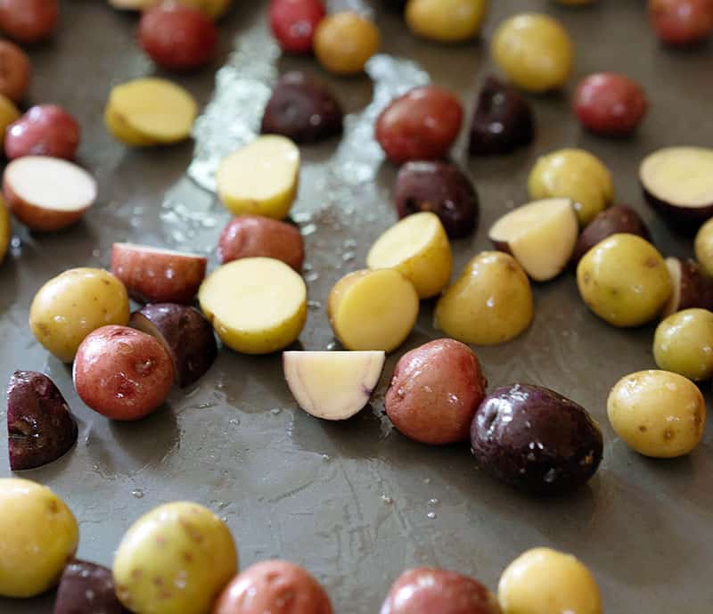 potatoes tossed in olive oil and placed on a sheet pan