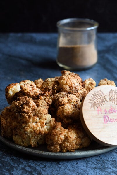 Air Fried Andouille Cauliflower on a blue ceramic plate