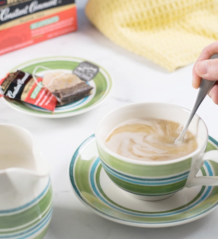 Cashew Almond Vegan Creamer being stirred in a cup