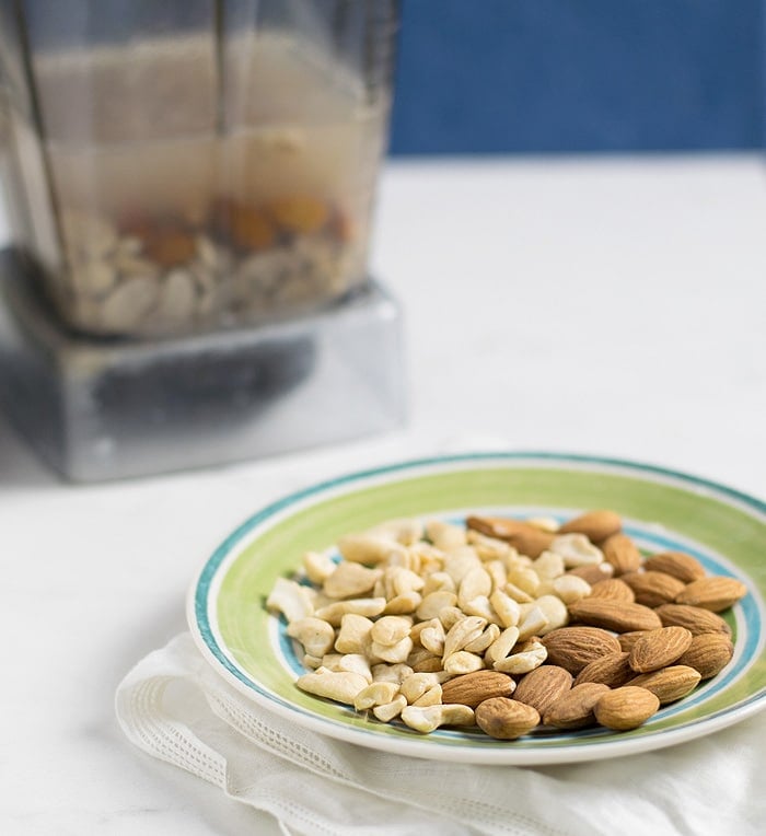 A plate of almonds and cashew pieces