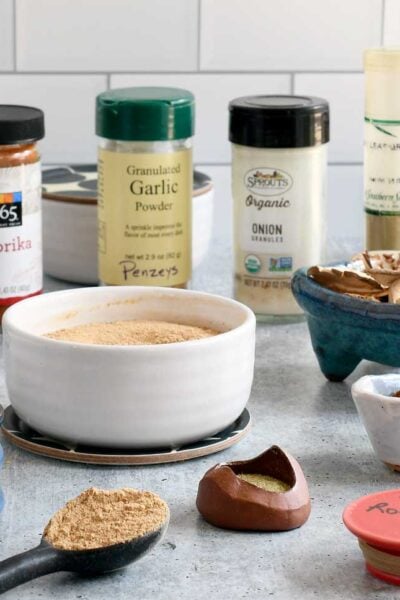 Easy Vegan Beef Broth Powder surrounded by all the ingredients you need to make it.