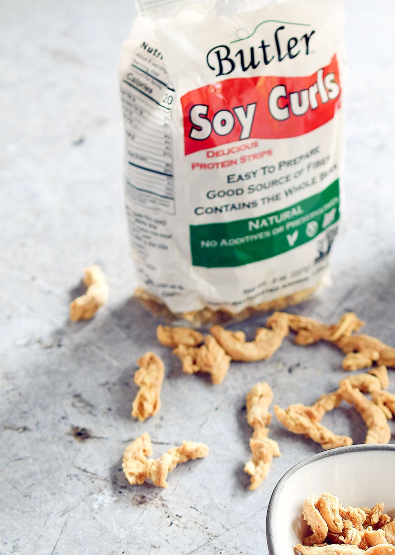Bag of Butler soy curls with dried soy curls scattered about
