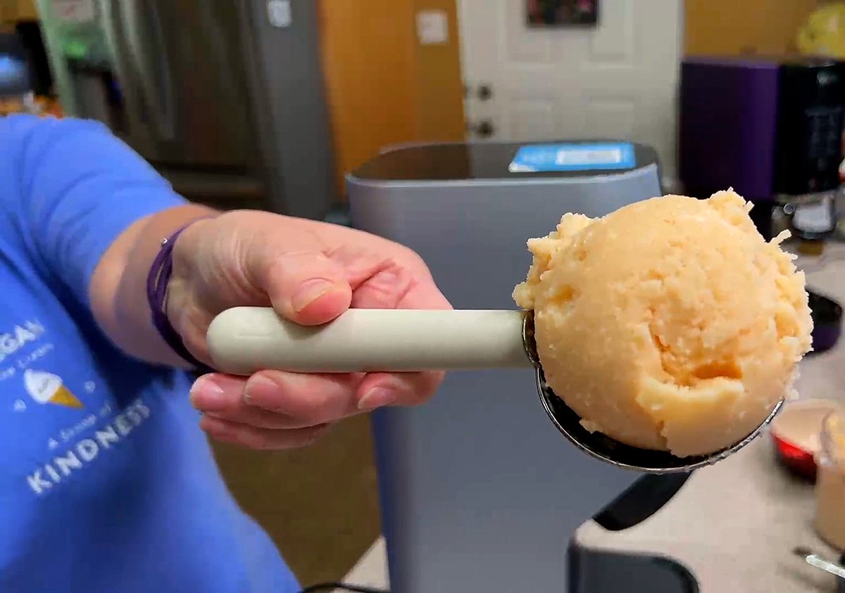 Ninja Creami vegan cantaloupe ice cream in a scoop