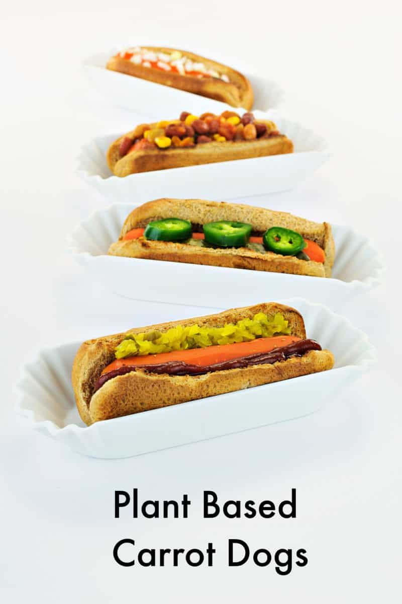 4 plant based carrot dogs on white background