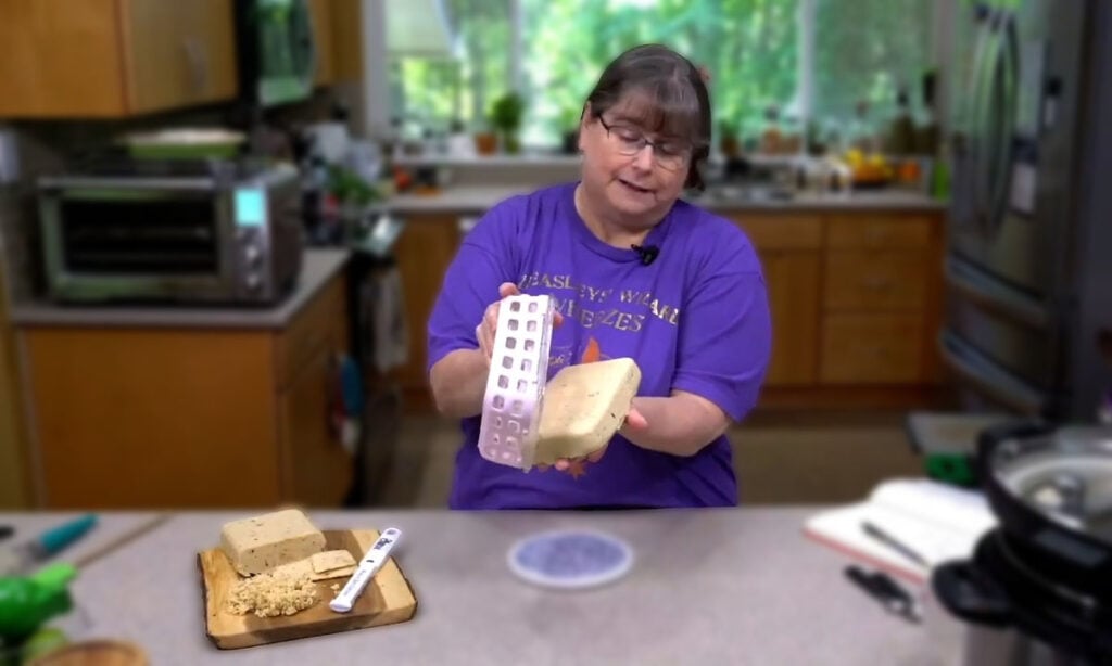 Kathy easily unmolding the set cheese!