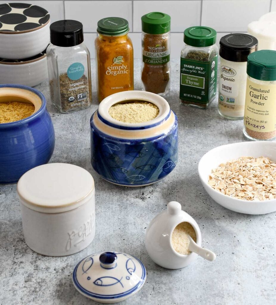 Vegan chicken gravy mix in a jar surrounded by the ingredients.