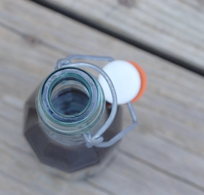A Lavender Syrup bottle on a wooden table