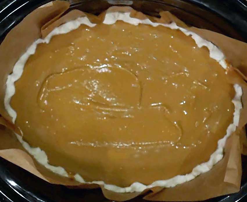 The pie in the slow cooker ready to cook.