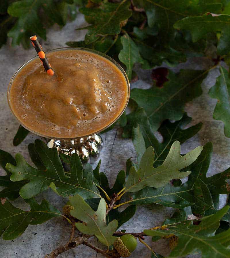Frozen pumpkin spice coffee in pumpkin stemmed martini glass
