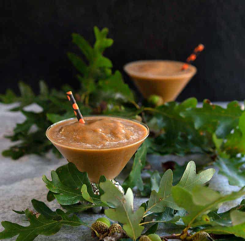 Frozen pumpkin spice coffee in pumpkin stemmed martini glass