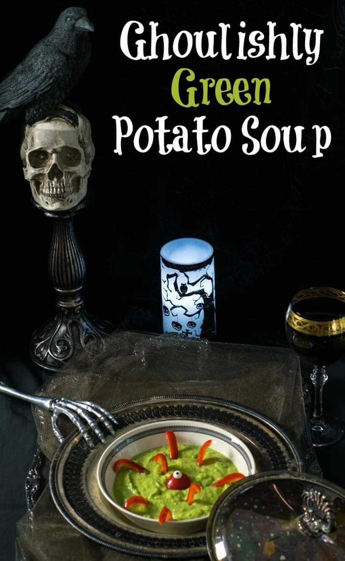 Ghoulishly Green Vegan Potato Soup served on a tarnished silver tray and decorated with a red pepper swamp monster.