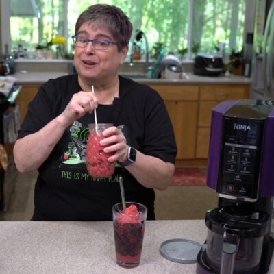 Kathy drinking a strawberry slushie