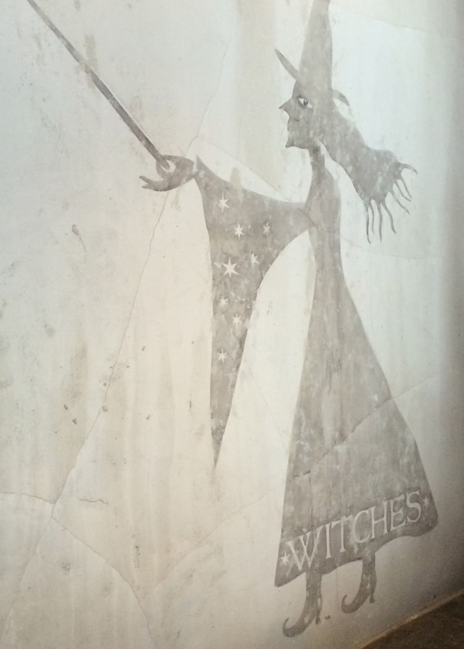 Painting of a witch on a wall at the wizarding world of Harry Potter