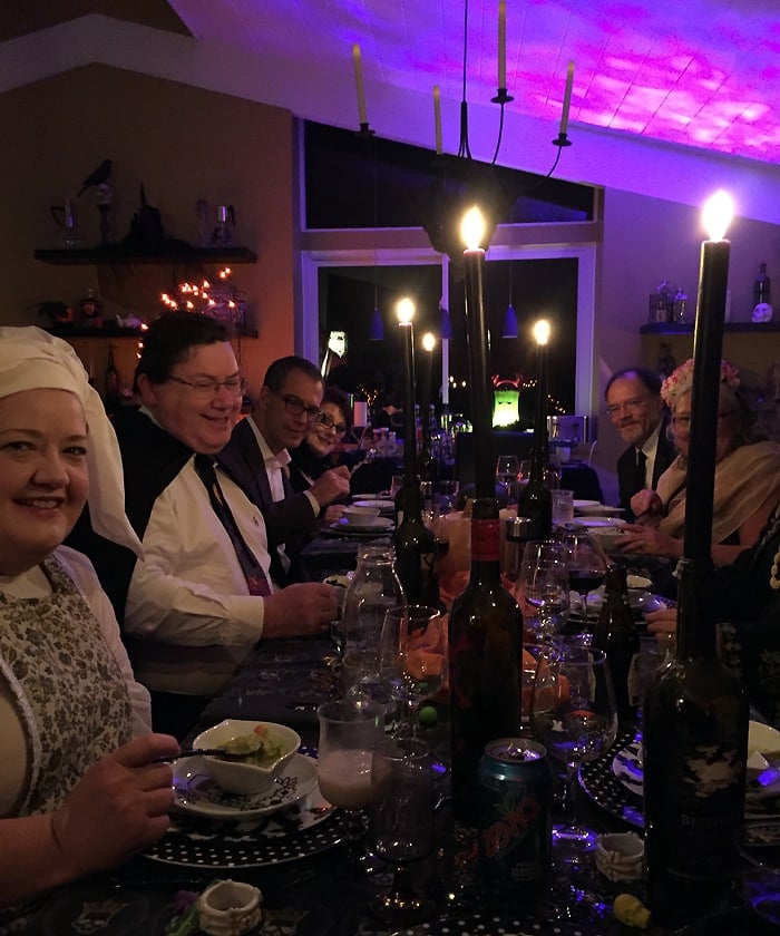 Dressed up guests eating my green potato soup 