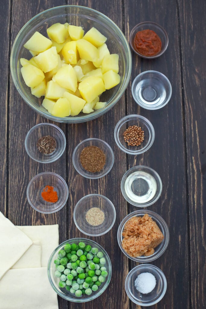 ingredients for making vegan air fryer samosas measured out in bowls.