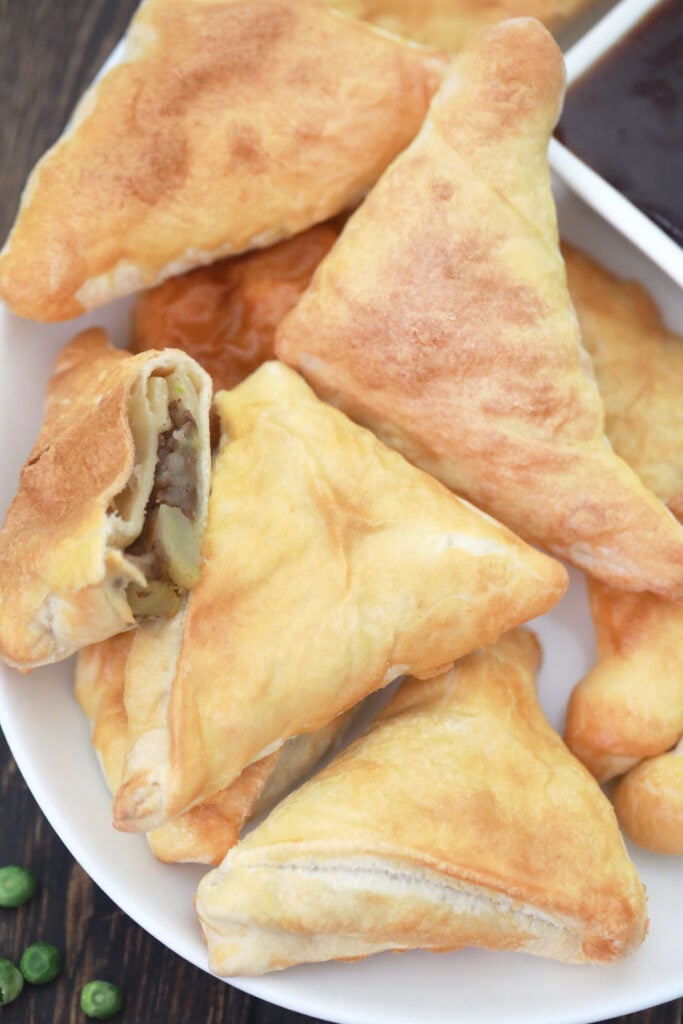 platter of vegan potato and pea samosas.