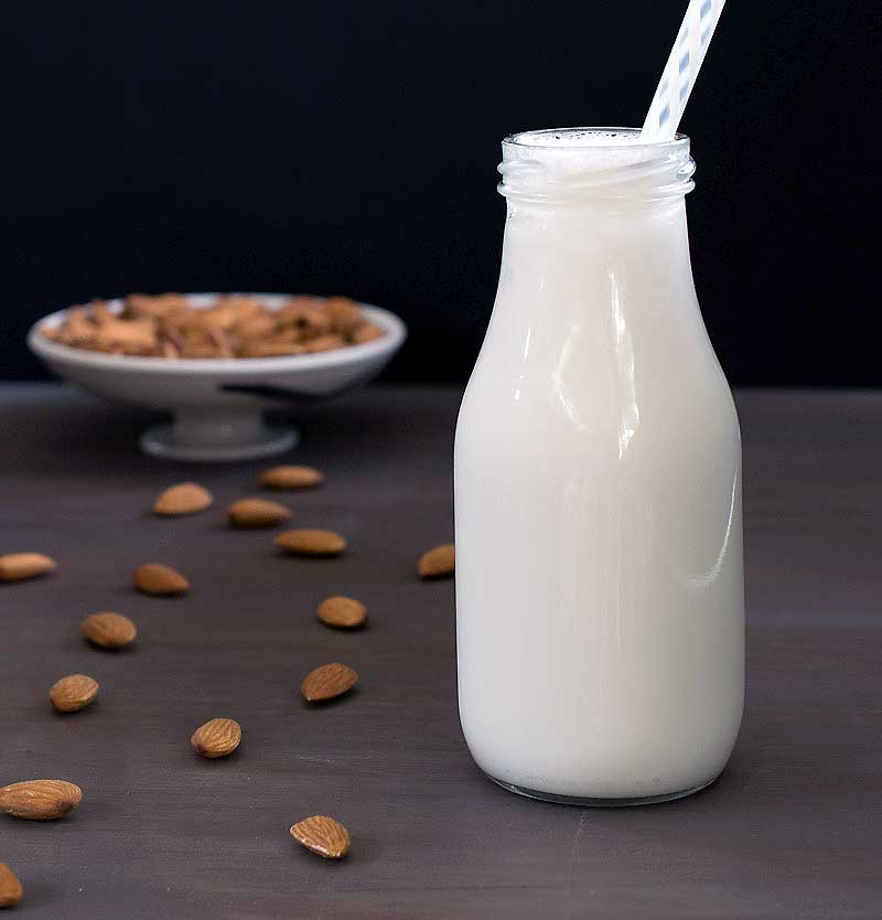 homemade almond milk in a milk bottle