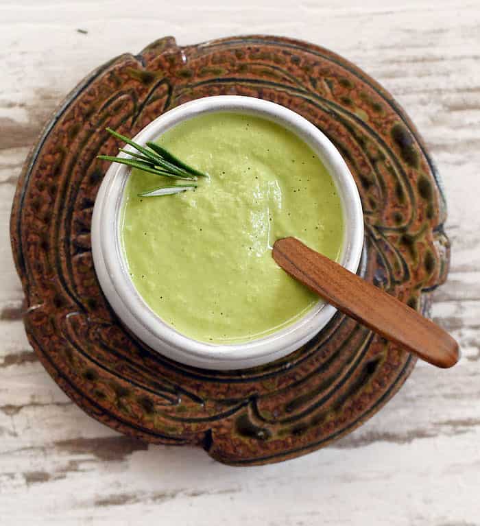 Kale Stem Creamy Pasta Sauce with rosemary sprig inside in a bowl