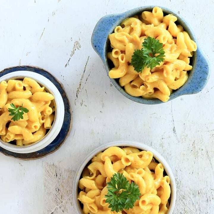 3 servings of vegan mac and cheese in bowls