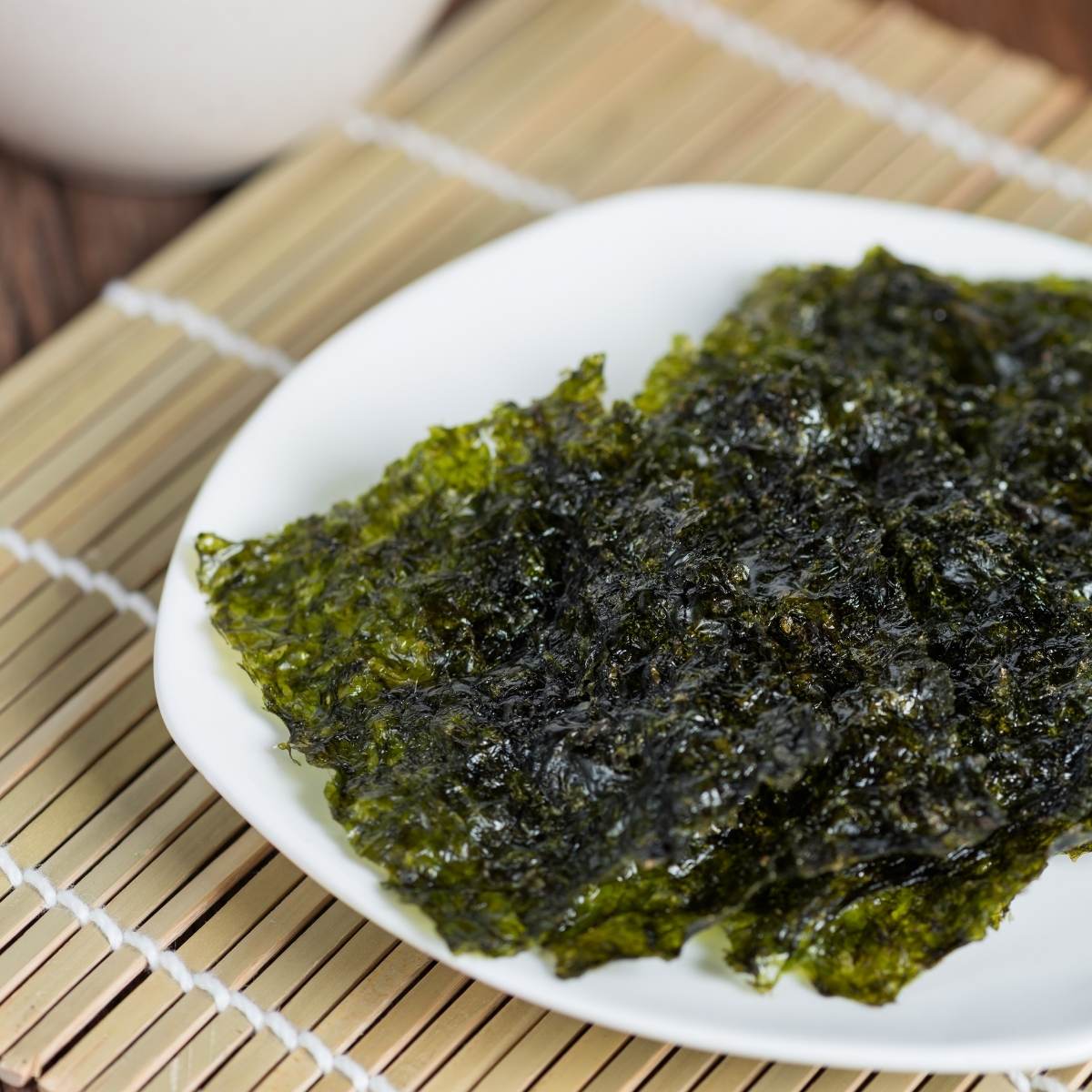 sheets of toasted nori on a white plate