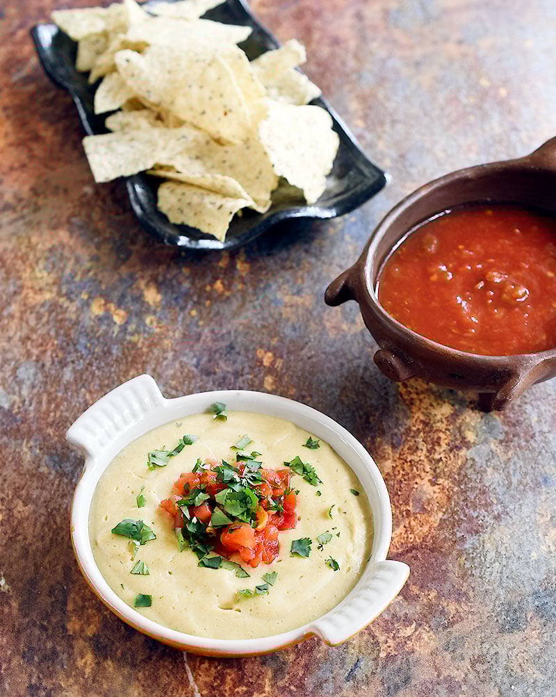 Oat Vegan Queso with a side of salsa and chips