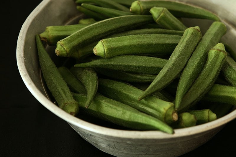 Fresh okra in a ceramic bowl