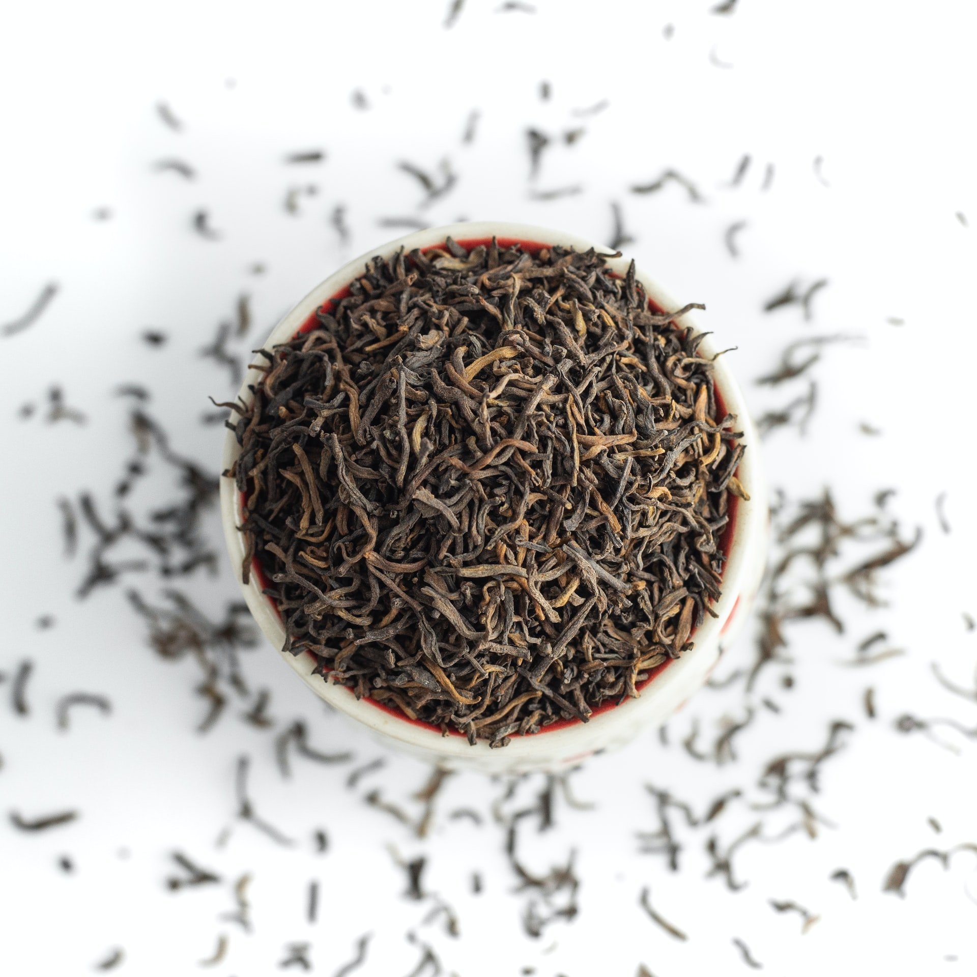 Loose leaf tea in a white bowl