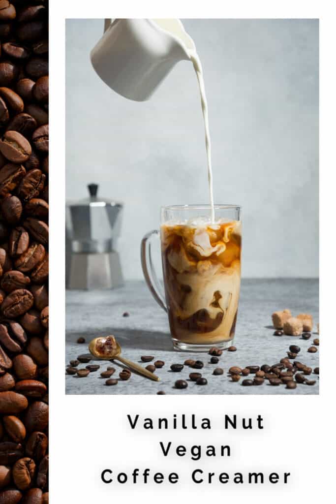 Creamer pouring into a glass mug of coffee with coffee beans scattered around it