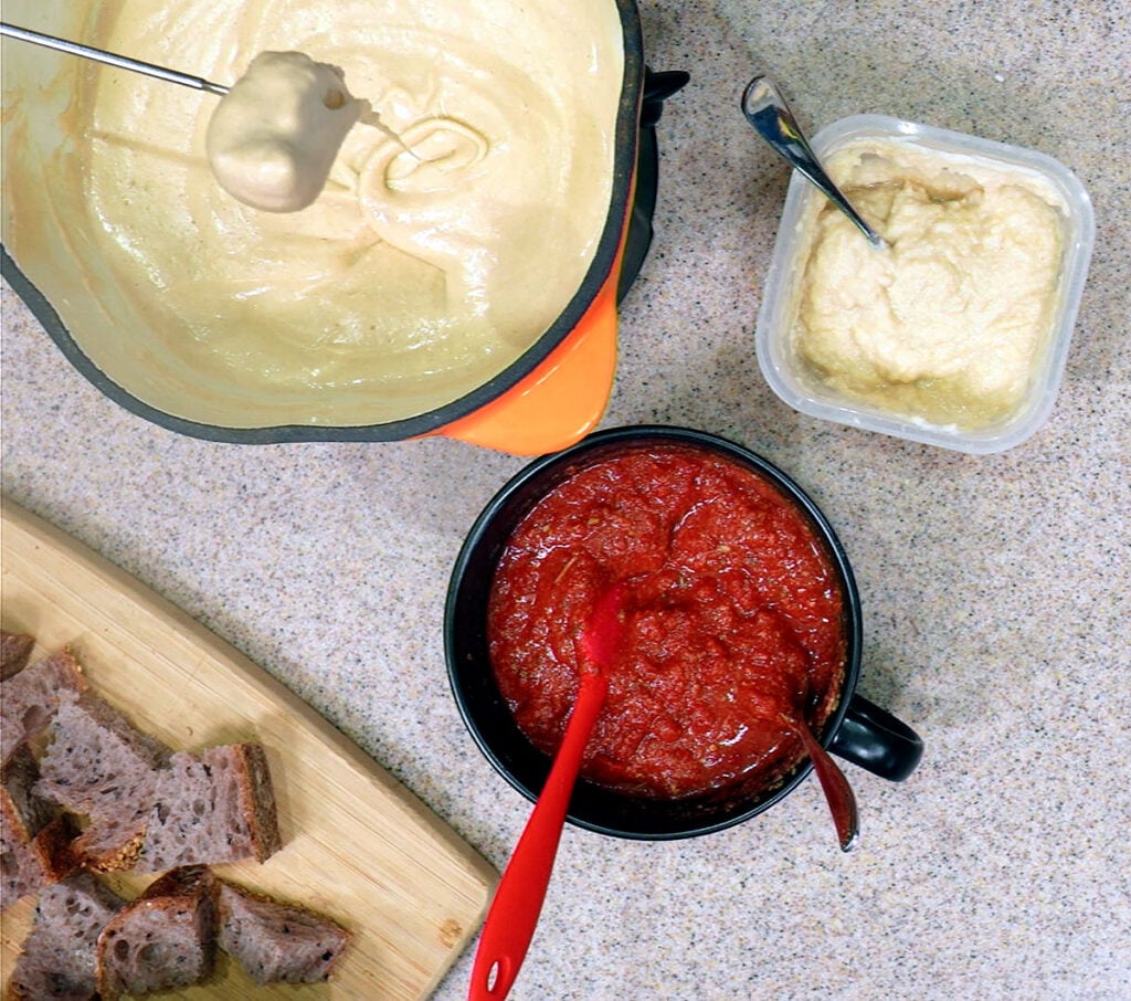 Pizza fondue with marinara as a separate dip and okara ricotta in the square contianer
