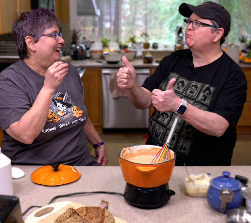 Kathy and Cheryl tasting the vegan pizza fondue