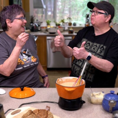 Kathy and Cheryl tasting the vegan pizza fondue