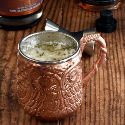 Pumpkin spice cocktail with rum in a bronze owl mug