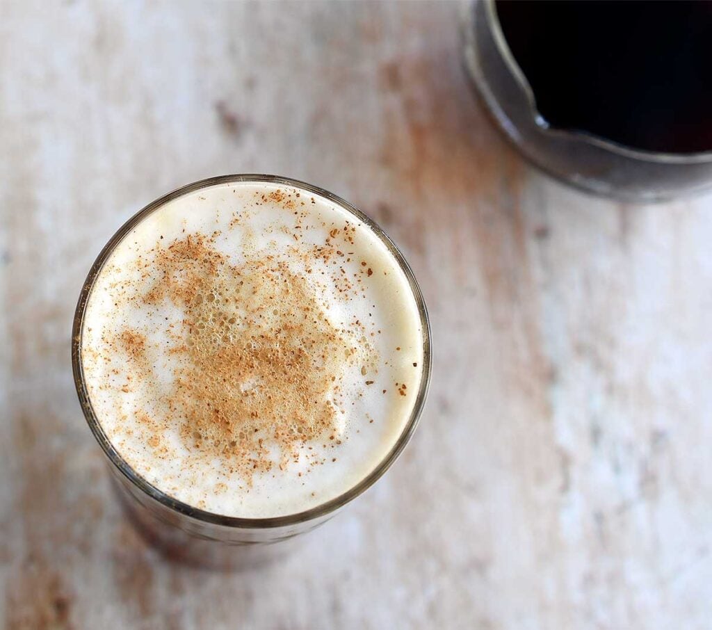 Vegan pumpkin spice latte with cold foam made in a Vitamix Aer pitcher.