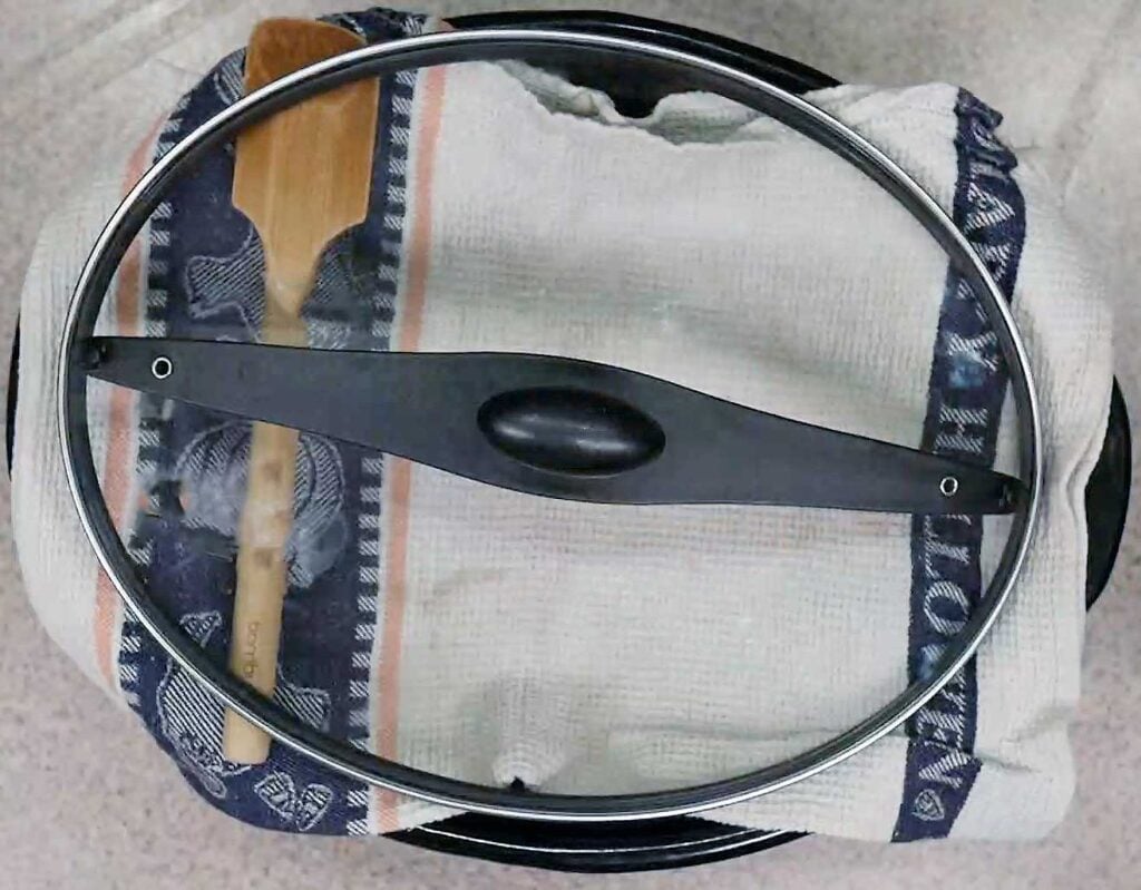 When you bake in a slow cooker you need to have a clean dishtowel in between the lid and crock to catch the condensation.