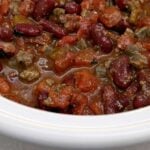 Slow cooker chili in a small white slow cooker.