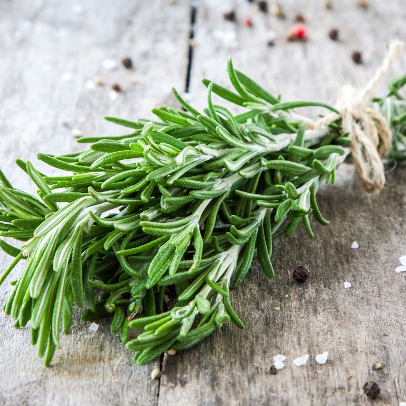 Fresh Rosemary in wooden table