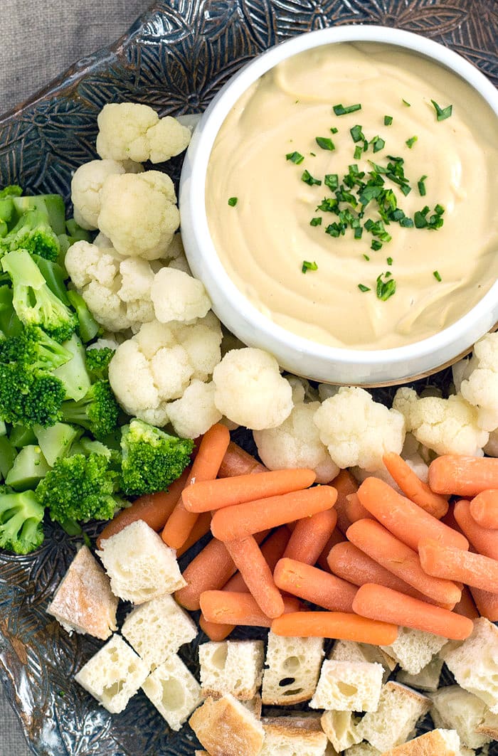 Vegan Fondue on a plate with hummus Dip in the middle