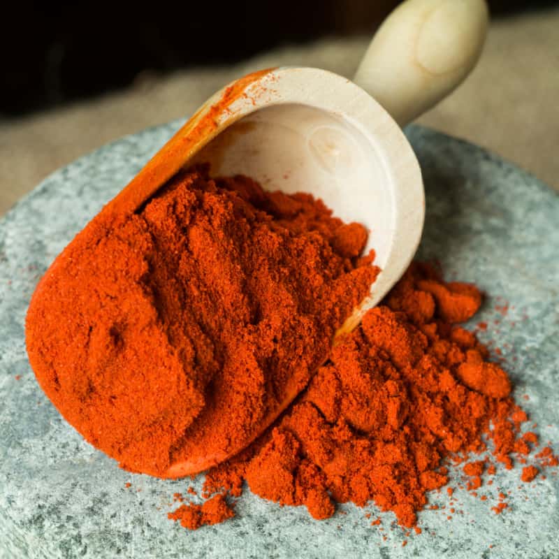 Smoked paprika in wooden scoop
