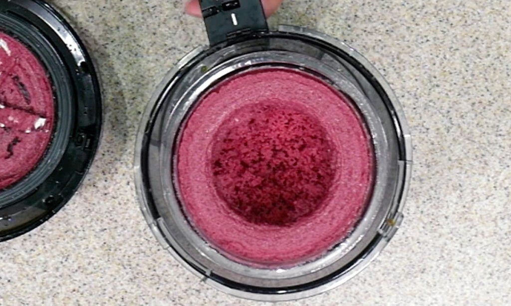 Cherry ice cream in a Ninja Creami pint and outer container