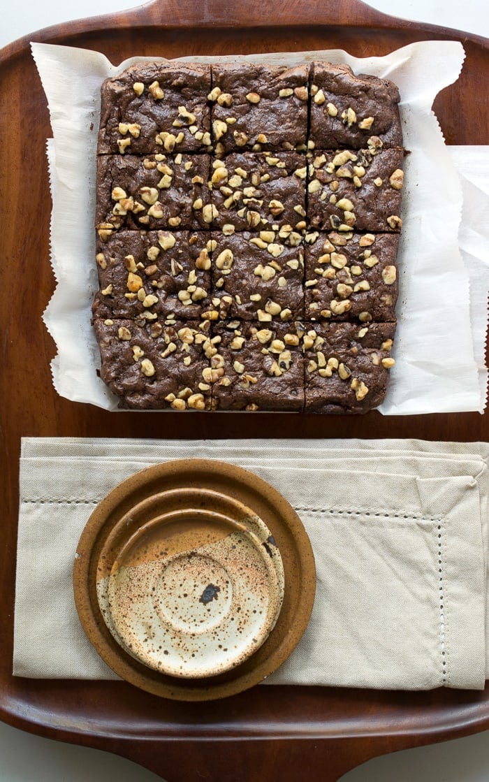 Gluten Free Vegan Teff Brownies cut on a teak tray
