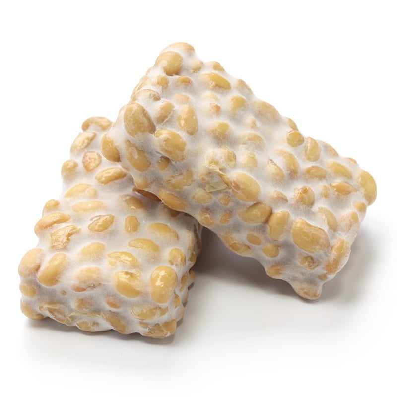 Raw tempeh on a white background