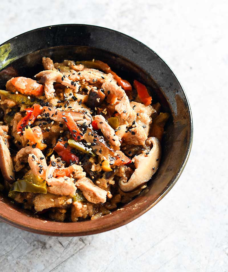 Date Sweetened Teriyaki Soy Curls in a brown ceramic bowl
