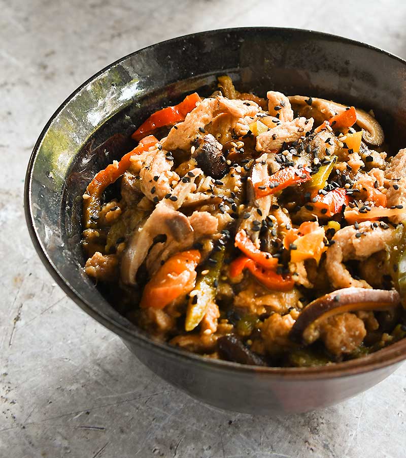 Date Sweetened Teriyaki Soy Curls in a brown ceramic bowl