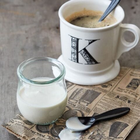 Vanilla nut vegan coffee creamer in coffee mug with a k on it
