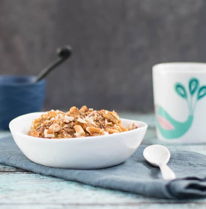 Vegan Slow Cooker Pumpkin Steel Cut Oats with a coffeecake topping in a white bowl