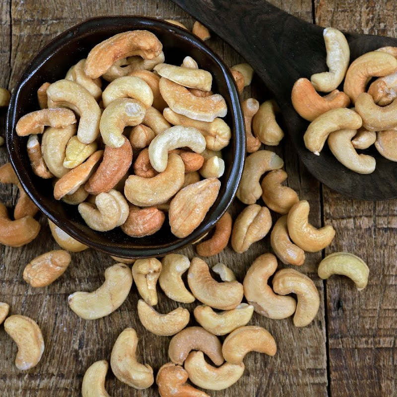 cashew nuts in a small black bowl