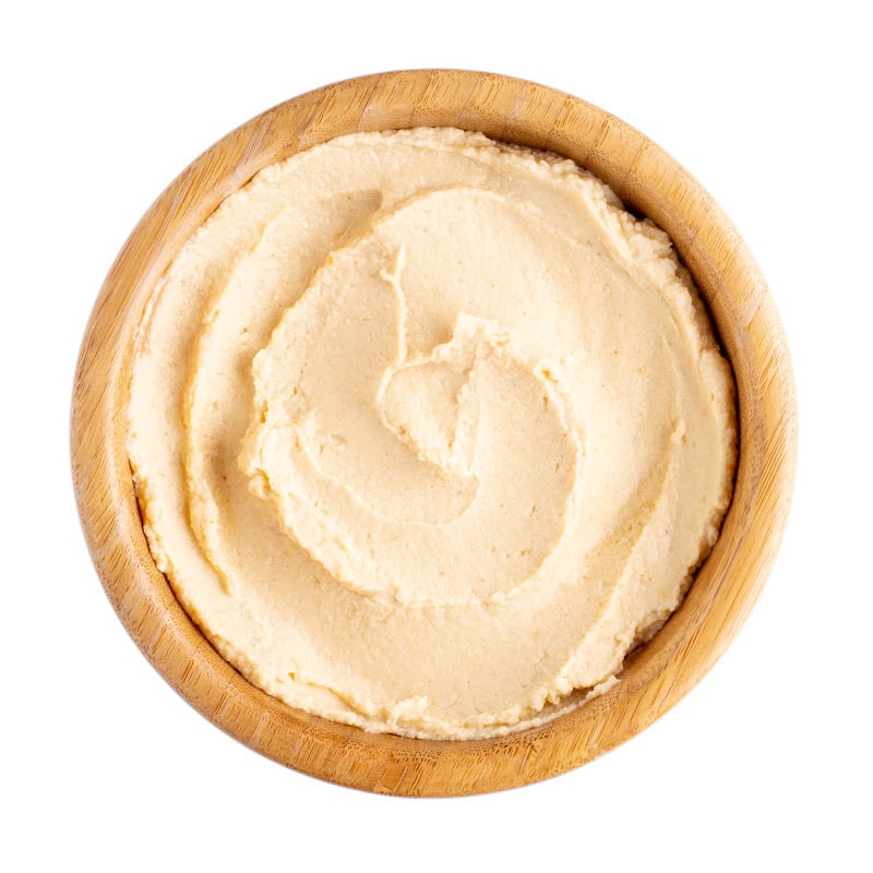 Hummus in a wooden bowl